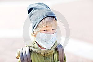 A small boy in protectionÃÂ mask outdoor